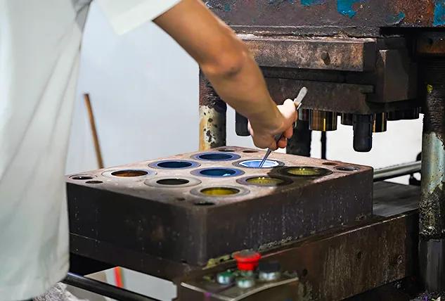 Worker Operating Industrial Molding Machine